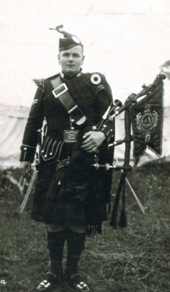 Highland piper in traditional dress