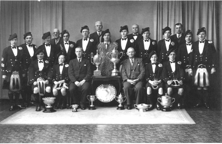 Allandale Pipe Band 1938 World Championship winners with Lord Inverclyde Shield, Sir Harry Lauder Shield, Crozier Shield and 72 medals at Cowal Games